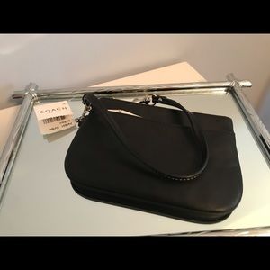 Coach - black leather wristlet with silver accents